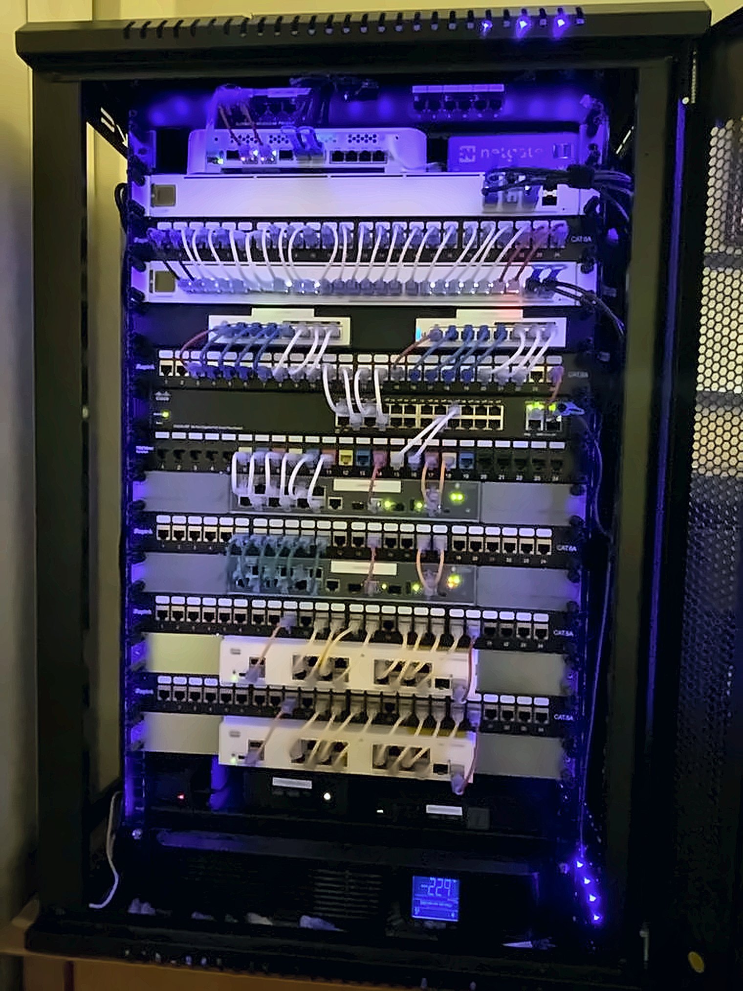 The lab rack at night, with status lights on.
